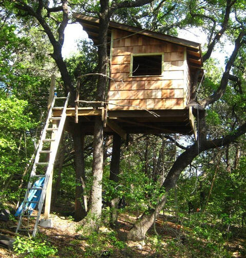 The treehouse I built for my nephews in Austin, TX out of mostly found materials. It had a 100' steel cable zipline going downhill from this side. (2010)